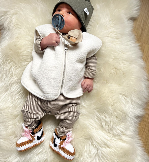 HOPPI crochet baby shoes worn by a baby