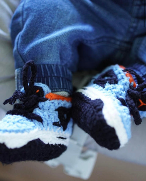 HOPPI crochet baby shoes worn by a baby